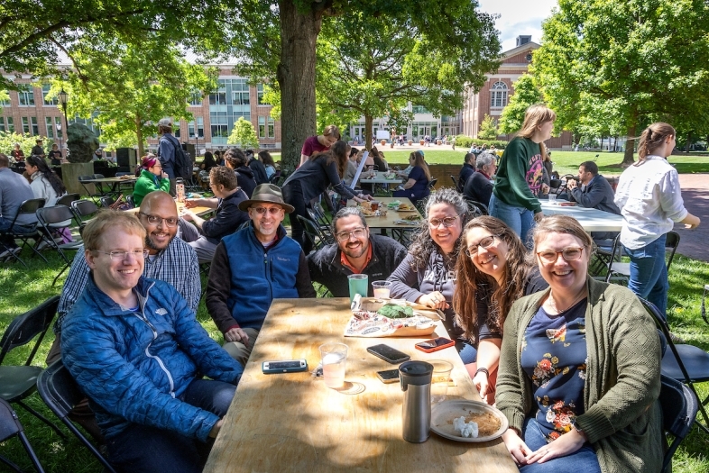 Faculty and Staff at Outdoor Table during Verna Miller Case Symposium