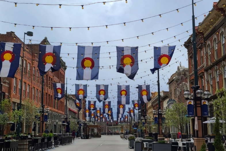 Colorado Flags hanging in an alley