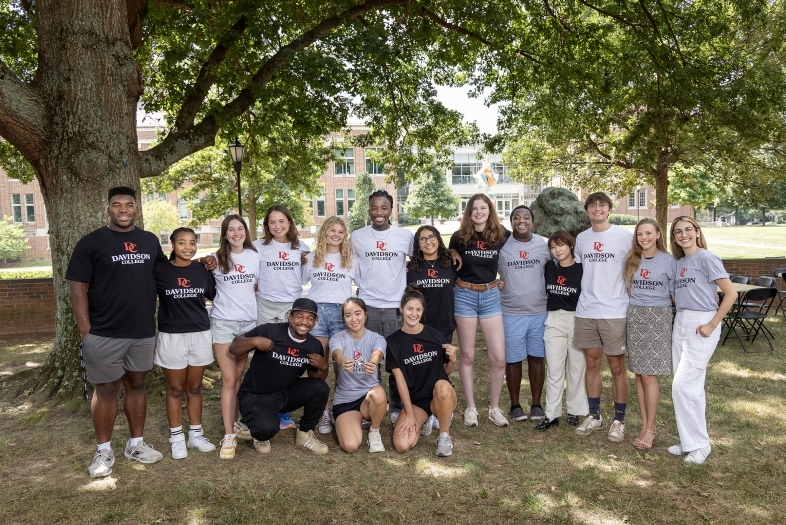 Students wearing tshirts with the new visual identity