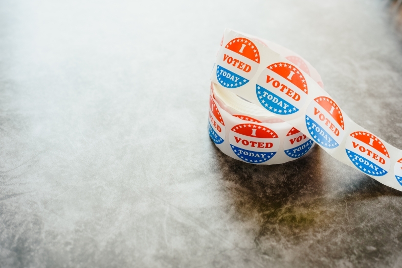 a roll of "i voted" stickers on a table