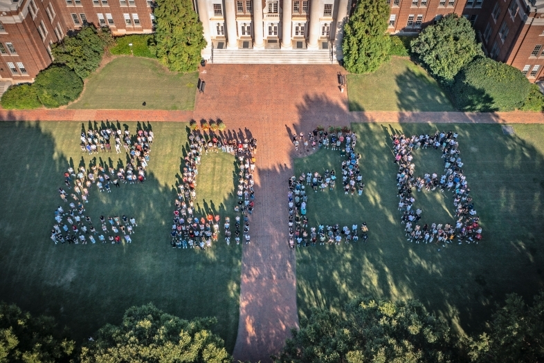 a group of students in the shape of "2028"