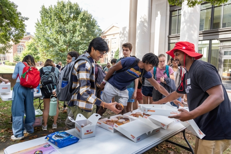 Daniel Heath serving students at Chaplains' Cafe