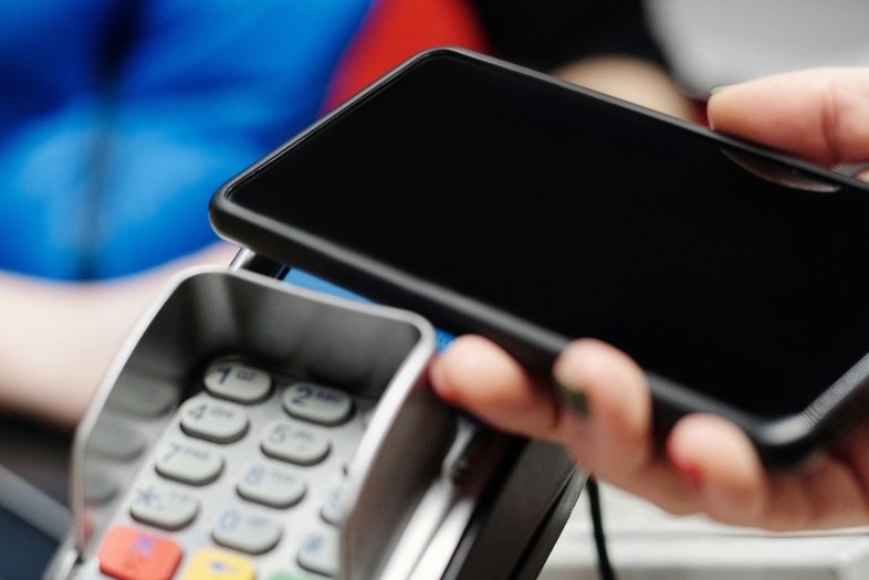 a phone scanning at a cash register