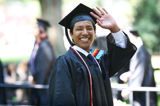 Student Waves at Camera