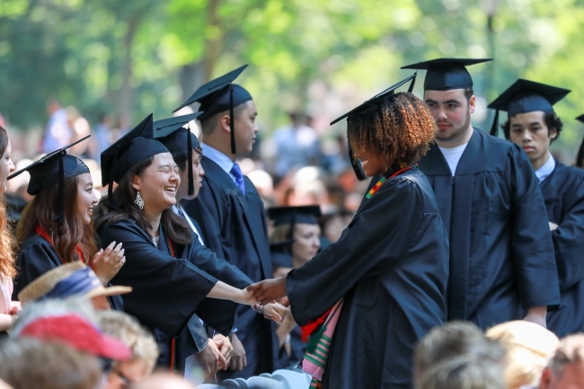 Students shake hands