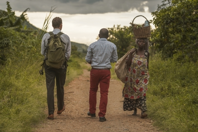 Ross Boyce with people from Uganda walking to water