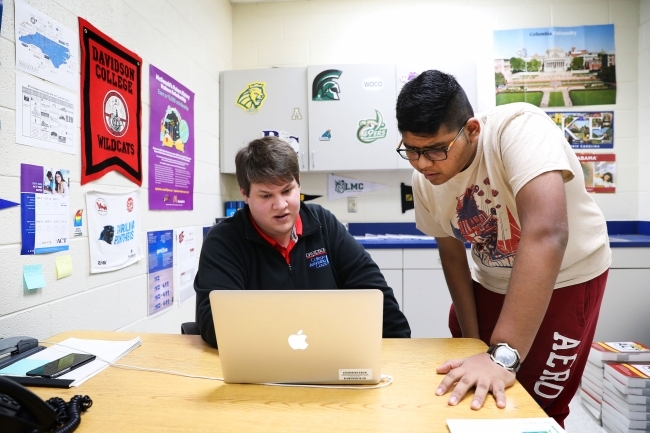 Thomas Hall meets with student