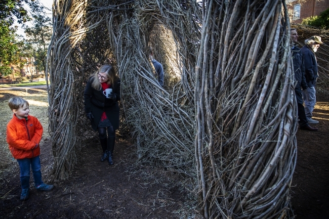 Patrick Dougherty Sculpture with kids visiting