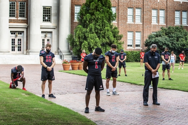 Social Justice Event - Football Team on the Green in front of Chambers