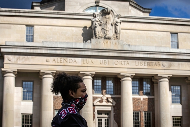 Social Justice Event - student in front of Chambers