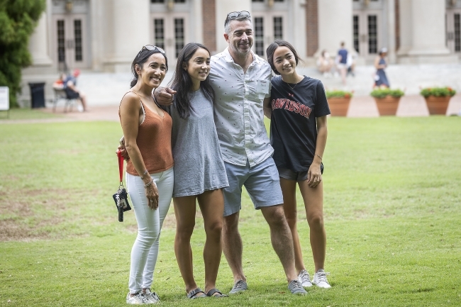 Student Taking a Family Photo at Farewell Picnic