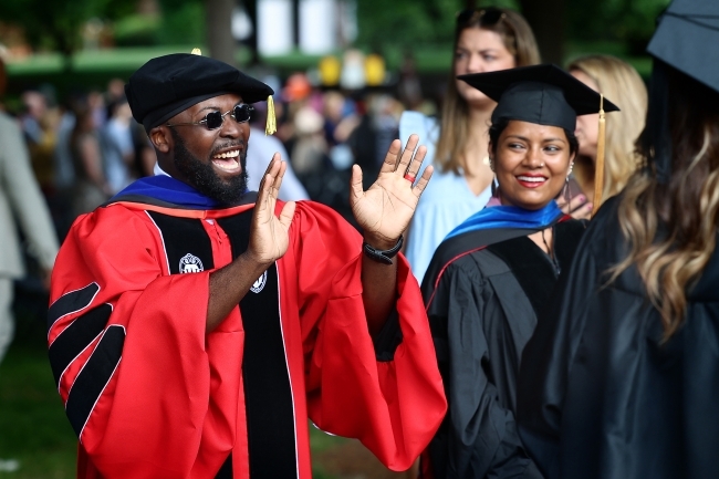 Class of 2020 Commencement professor waving to grad