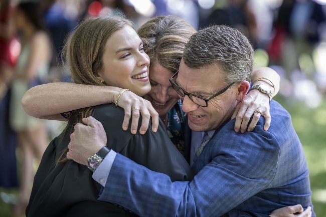 Commencement Class of 2020 Parents hug their recent grad