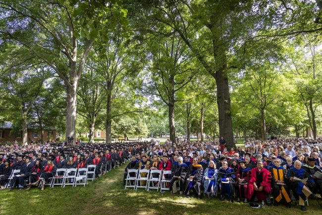 commencement lawn of students, faculty and family 