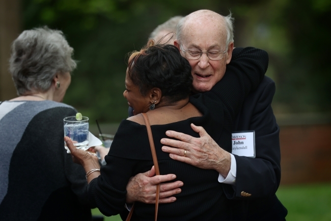 Alumni hugging at reception