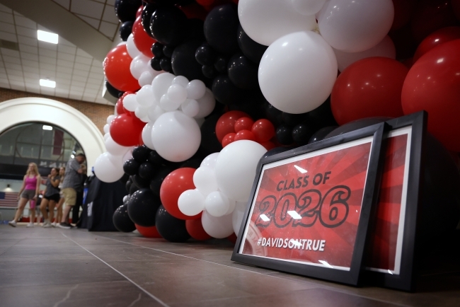 Class of 2026 sign with balloons in background