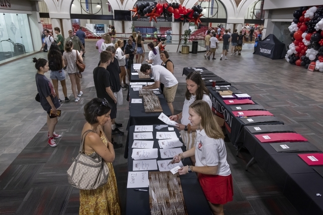 Parents meet with staff at Orientation Fair 2022