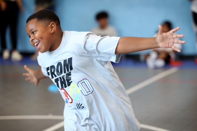 Student running and smiling