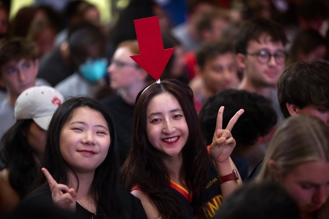 Two students wearing costumes