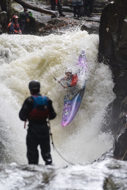 Male kayaker down steep drop