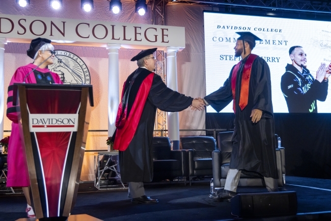 Stephen Curry receiving his diploma from Davidson College President Douglas Hicks