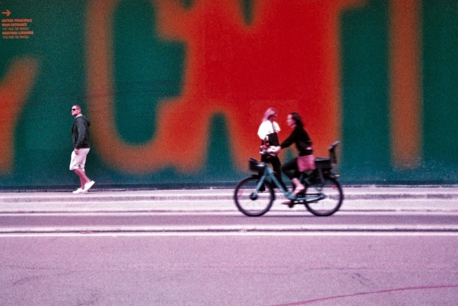 Photo taken by Claire Begalla ’24: pedestrians and cyclist on city street