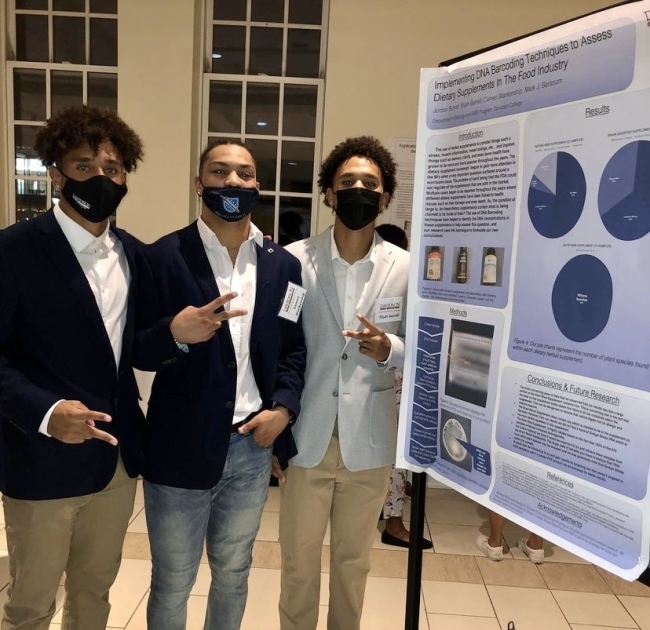 PCC men presenting research