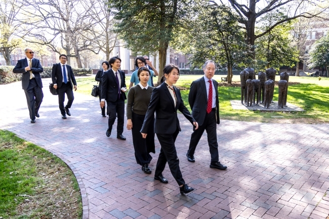 Koji Tomita '77 walking through campus