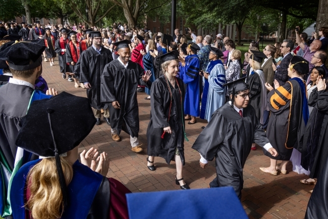 Graduation procession of students in caps and gowns