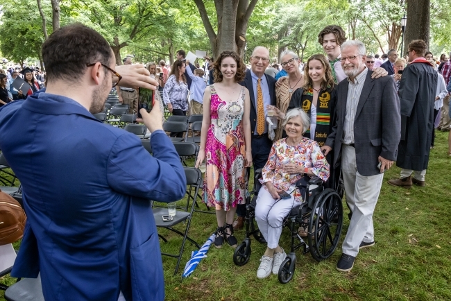 Family poses together for picture during graduation celebration