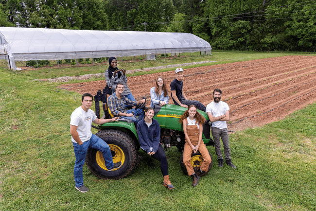 Students seated on a tractor