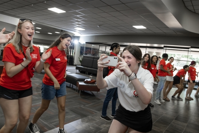 Student takes picture during Orientation 2023