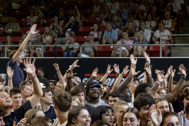 Waving hands in a crowd 