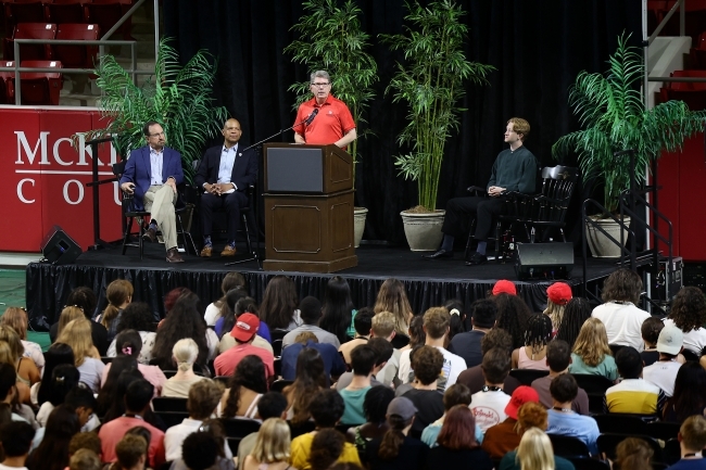 President Hicks speaks from podium