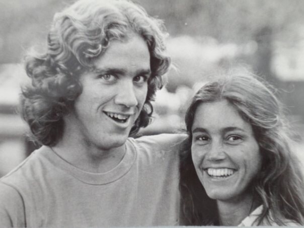 a young mand and woman smile together in a black and white yearbook photo