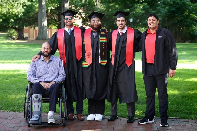 a group of students in graduation robes together