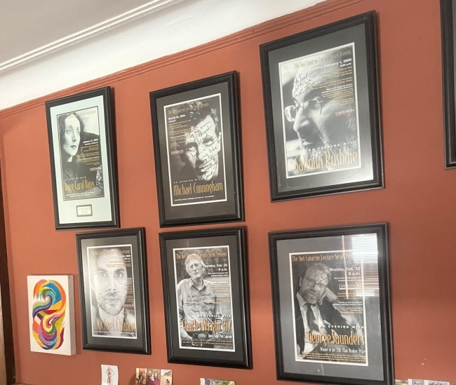 a wall covered with signed posters