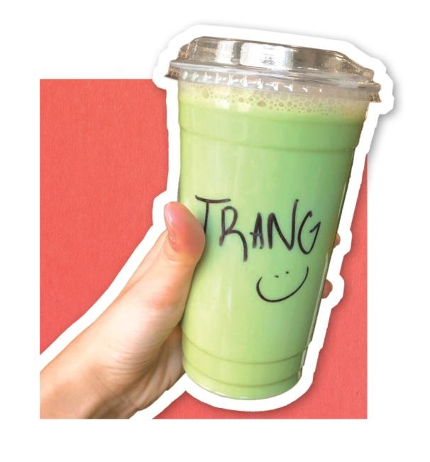 Cup of matcha latte with Trang written on it