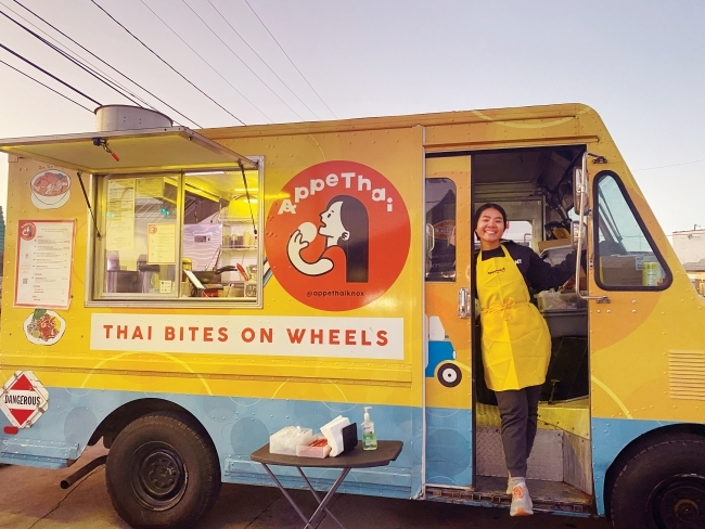 Thitinart Boriboon standing in the door of her AppeThai food truck