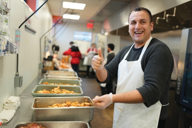 Real Good Kitchen member preparing food in the kitchen