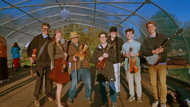 the Appalachian Ensemble in a greenhouse