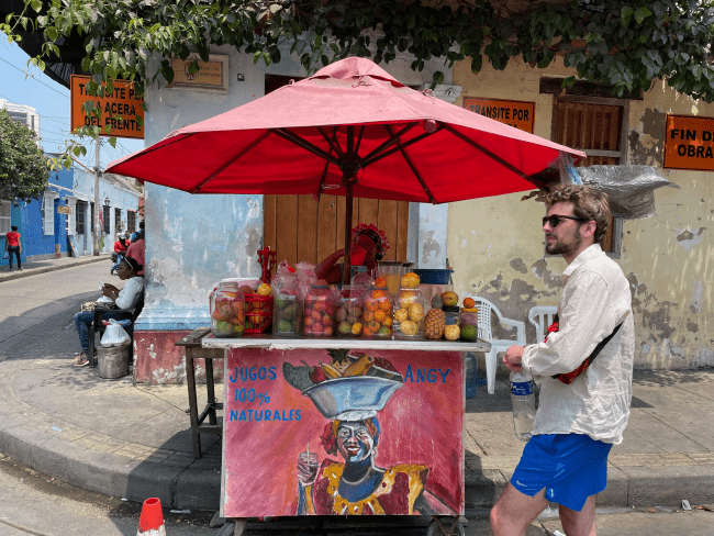 a juice cart on a street in Colombia