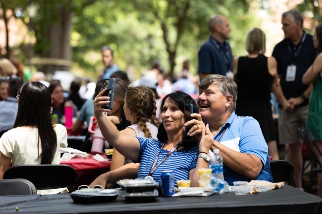 Parents take a selfie at the orientation picnic