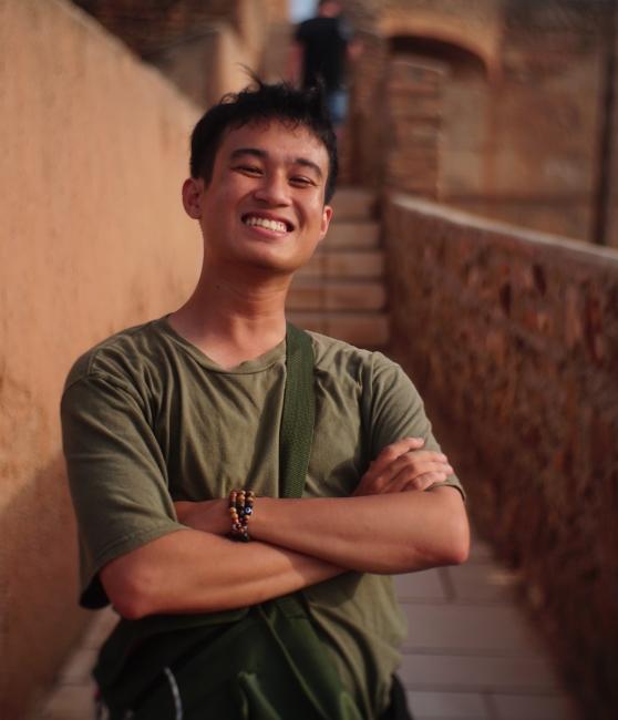 a young Vietnamese man smiling