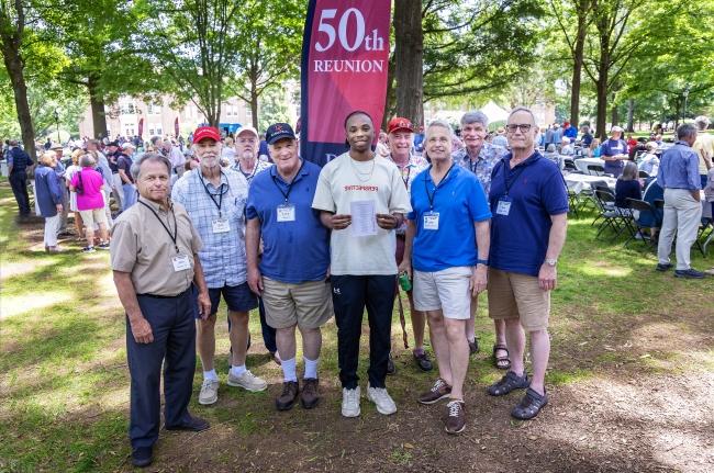 Group of alums and a student (center) at 50th Reunion