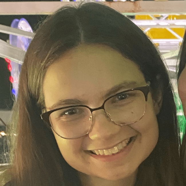 a young white woman wearing glasses