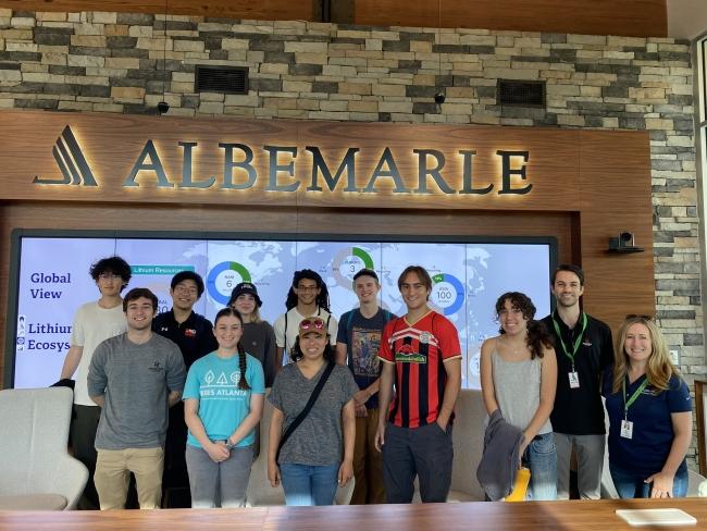 a group of students standing in front of a screen that reads "Albemarle"