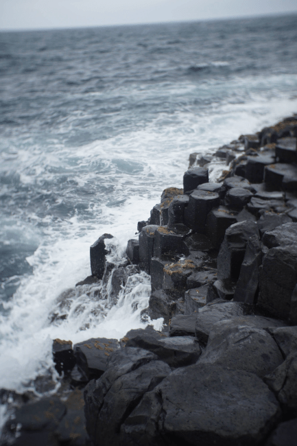 a rocky shoreline along the ocean