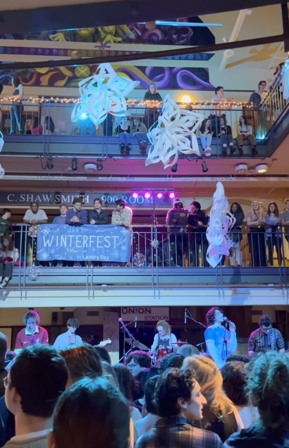 a band performs in a winter-themed student space