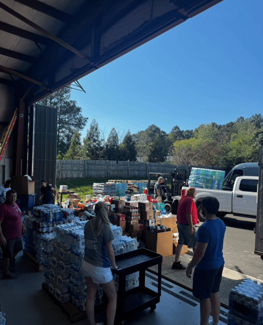 a group of people collecting supplies for hurricane relief